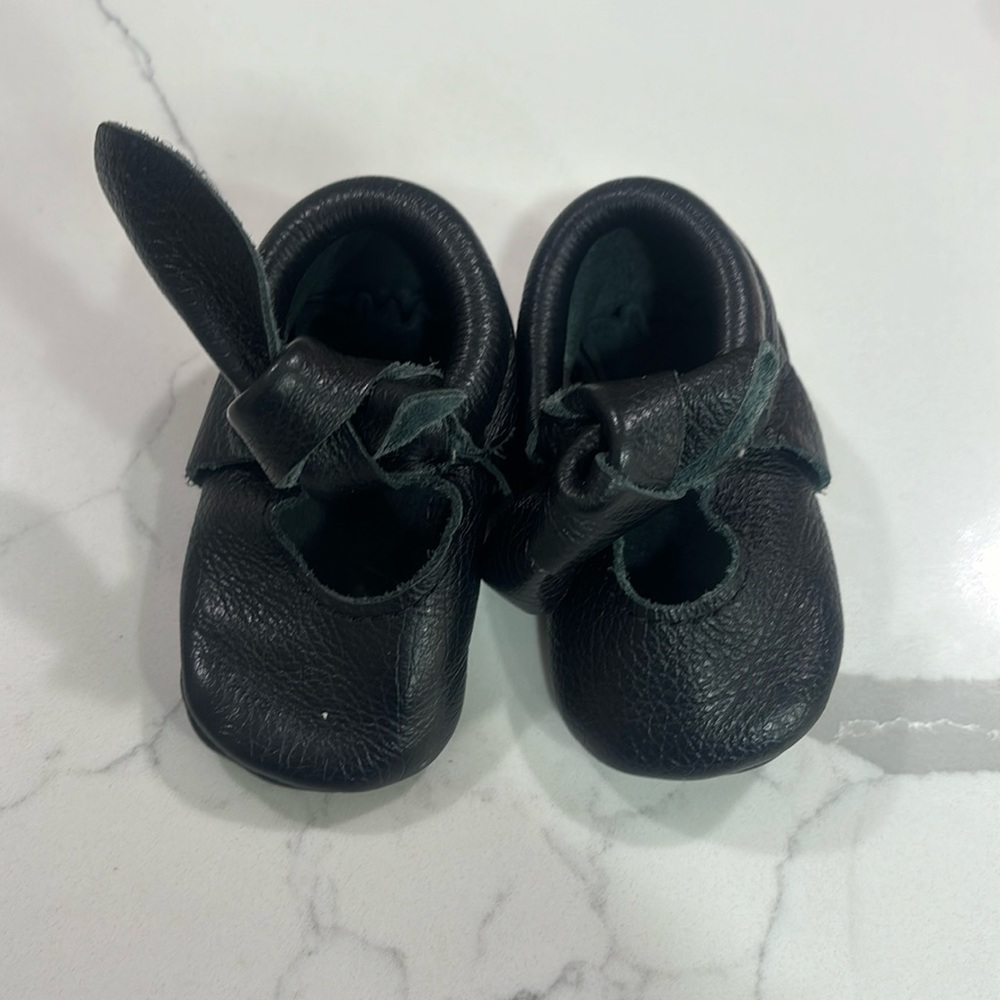 Black freshly picked baby shoes